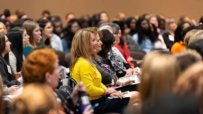 Retreat attendees at a conference session